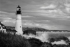 High Surf Breaks Over Rocks By Portland Head Lighthouse -BW